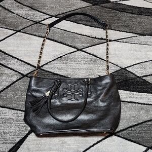TORY BURCH BLACK PEBBLE LEATHER EMBOSSED TASSELS PURSE BAG